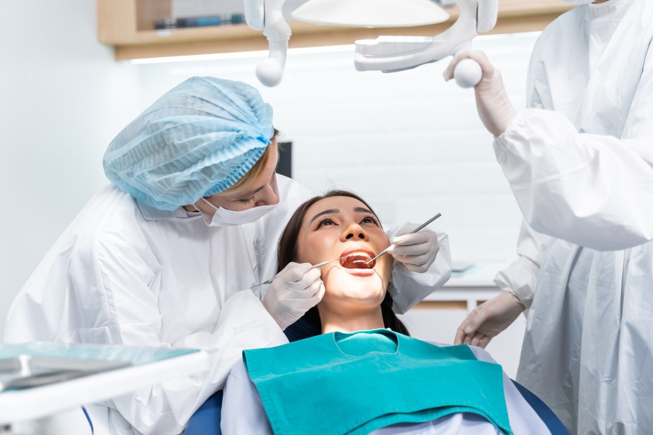Centro Recanto das Garças 8 caucasian dentist examine tooth for young girl at dental health clinic